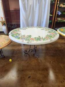 lot 205 image: Round tabletop with floral design on crackled white background -Table base included - 49D x 30H - Bldg. J