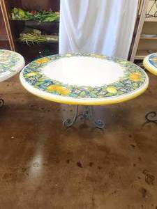 lot 220 image: Clay tabletop with lemons and oranges in a floral motif with crackled white background -Table base included - 50D x 30H - Bldg. J