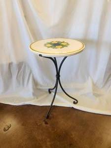lot 115 image: Small ceramic tabletop with lemons on crackled off-white background -Table base included - 19D x 28H - Bldg. J