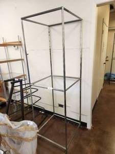 lot 44 image: Metal display rack with glass shelves - 24 x 24 x 76 Bldg. J