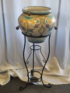 lot 87 image: Artist signed cache pot (13H) with galvanized iron plant stand included. this matches the table in lot 182