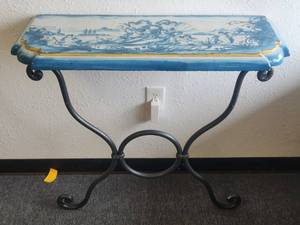 lot 101 image: Wall console table set that includes galvanized iron base and hand painted clay top. Tabletop features Angels in hues of blue