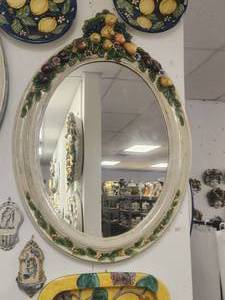 lot 127 image: Very large and ornate wall mirror with raised fruit motif. Edge trim in white -