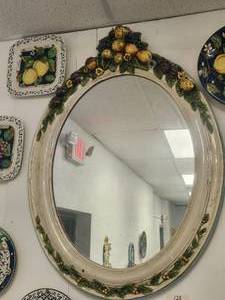 lot 128 image: Very large and ornate wall mirror with raised fruit motif. Edge trim in blue -