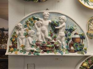 lot 131 image: Large wall art of raised babies frolicking amongst the grapes. Such details