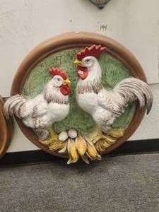 lot 144 image: Large round wall art with raised depiction of two roosters guarding the eggs and corn -