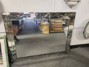 lot 134 image: Large, antiqued mirror with beautiful beveling details. has crack in bottom right corner