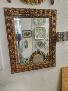 lot 209 image: Large, beveled wall mirror with intricately carved frame painted in gold (35 x 42)