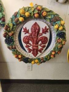 lot 161 image: Large wall art piece with center crest surrounded by della robbia style garland and various fruits