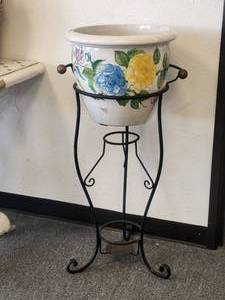 lot 91 image: Butterflies frolic around the grapes and flowers on this crackle-antiqued cache pot (13). Galvanized stand included Overall (38H)