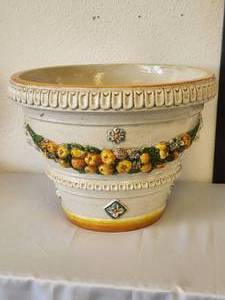 lot 112 image: Large planter encircled with raised garland of fruits and flowers and guarded by lion heads on each side