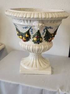 lot 228 image: Large garden Urn with raised garland of fruits and ribbons with crackled off white background - (19 x 20)