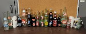 lot 9 image: DR. PEPPER COLLECTIBLE BOTTLES AND MORE AS SHOWN.
