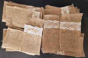 lot 30 image: (50) SILVERWARE SLEEVES IN STYLEDESIGN SHOWN.