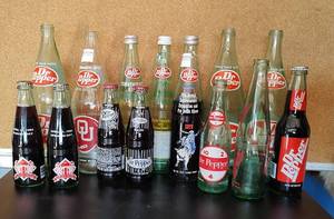 lot 56 image: DR. PEPPER COLLECTIBLE BOTTLES AS SHOWN.
