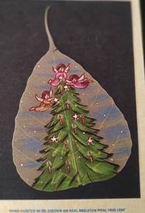 lot 71 image: UNIQUE SKELETON PIPAL TREE LEAF HAND PAINTED IN OIL COLOUR IN DESIGN SHOWN. TAKE A LOOK