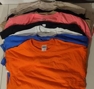 lot 99 image: (24) NEW T-SHIRTS IN ASSORTED COLORS AND SIZES AS SHOWN. PERFECT FOR PRINTING (SOLD 24 X THE MONEY)