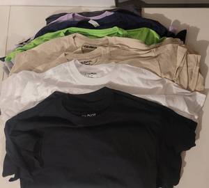 lot 100 image: (24) NEW T-SHIRTS IN ASSORTED COLORS AND SIZES AS SHOWN. PERFECT FOR PRINTING (SOLD 24 X THE MONEY)