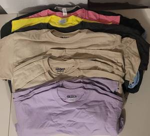 lot 101 image: (24) NEW T-SHIRTS IN ASSORTED COLORS AND SIZES AS SHOWN. PERFECT FOR PRINTING (SOLD 24 X THE MONEY)