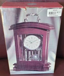 lot 7 image: NEW WALLACE WOODEN TABLE CLOCK WITH SILVER PLATED PENDULUM IN BOX AS SHOWN.