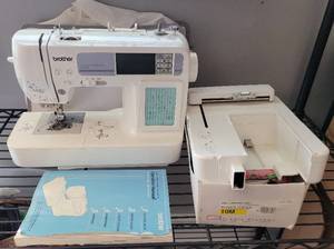 lot 13 image: BROTHER SEWING AND EMBROIDERY MACHINE HE-240 WITH ACCESSORIES, MANUAL, AND COVER AS SHOWN.