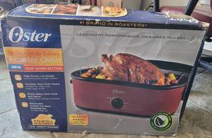 lot 33 image: OSTER 18-QUART ROASTER OVEN WITH BOX AS SHOWN.