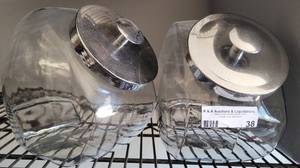 lot 38 image: (2) GLASS CANDY  COOKIE JARS WITH CHROME LIDS AS SHOWN.
