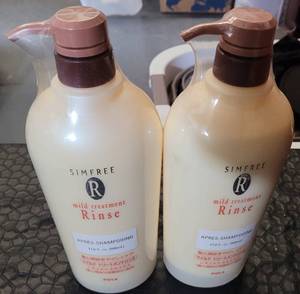 lot 220 image: (2) RINSING SHAMPOO BOTTLES AS SHOWN. (SOLD 2 X THE MONEY)